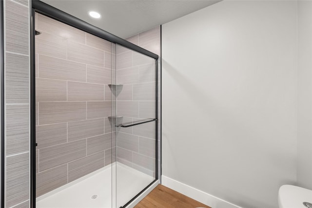 1217 NW Morningside Ct, Grimes, IA 50111 - full bath featuring a shower stall, wood finished floors, and recessed lighting