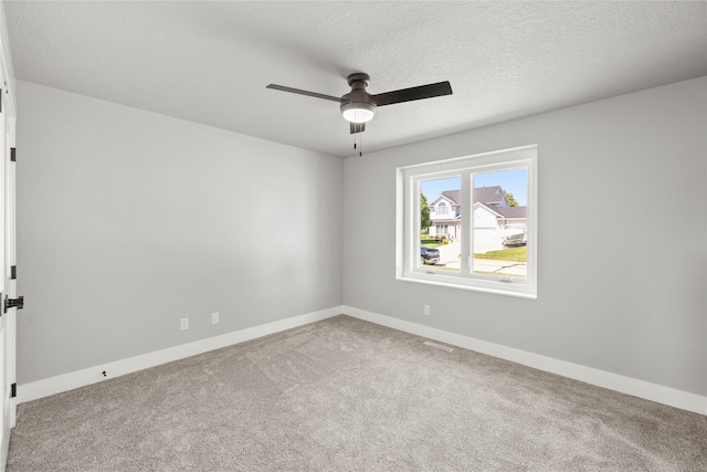 1217 NW Morningside Ct, Grimes, IA 50111 - empty room featuring a ceiling fan, carpet floors, and a textured ceiling