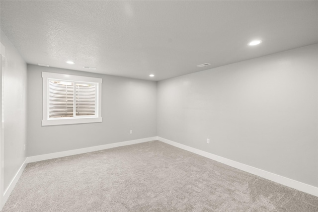 1217 NW Morningside Ct, Grimes, IA 50111 - carpeted empty room featuring recessed lighting and a textured ceiling