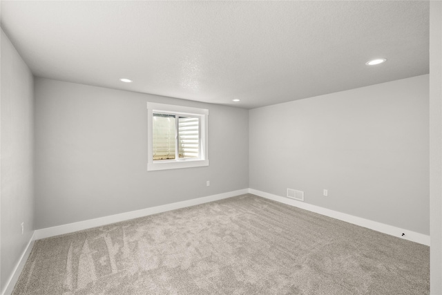 1217 NW Morningside Ct, Grimes, IA 50111 - carpeted spare room with recessed lighting