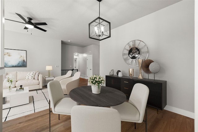 1217 NW Morningside Ct, Grimes, IA 50111 - dining area featuring a chandelier, ceiling fan, and wood finished floors