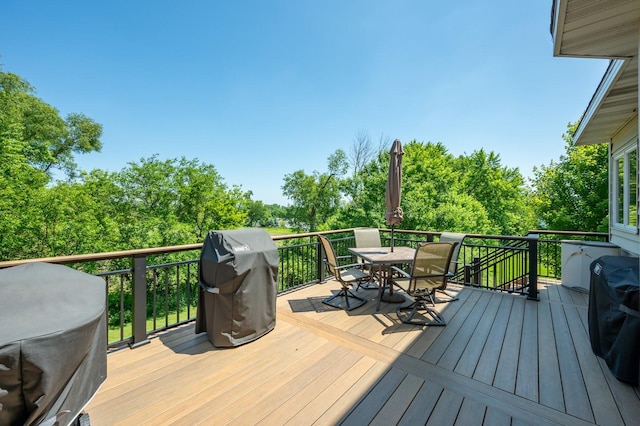 105 Everett Cir, Mingo, IA 50168 - wooden deck with outdoor dining area and grilling area