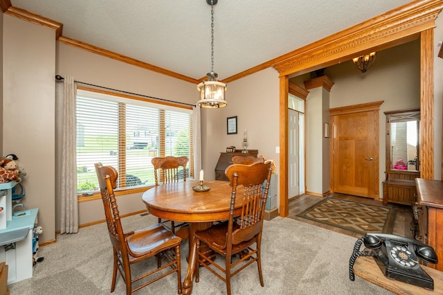105 Everett Cir, Mingo, IA 50168 - dining room featuring a chandelier, light colored carpet, ornamental molding, and a textured ceiling