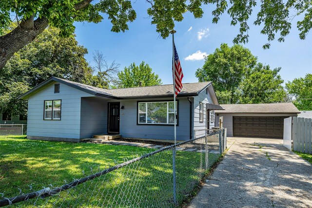 3113 E 36th Ct, Des Moines, IA 50317 - ranch-style home featuring a garage, a shingled roof, and driveway