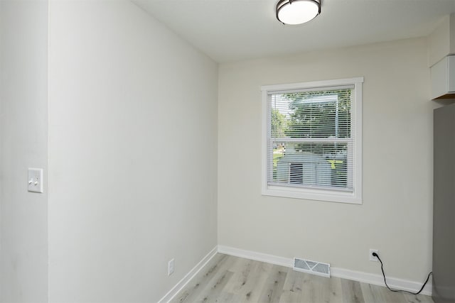 3113 E 36th Ct, Des Moines, IA 50317 - empty room with light wood finished floors and baseboards