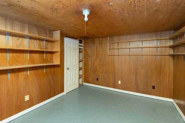 3113 E 36th Ct, Des Moines, IA 50317 - spare room with baseboards and wood walls