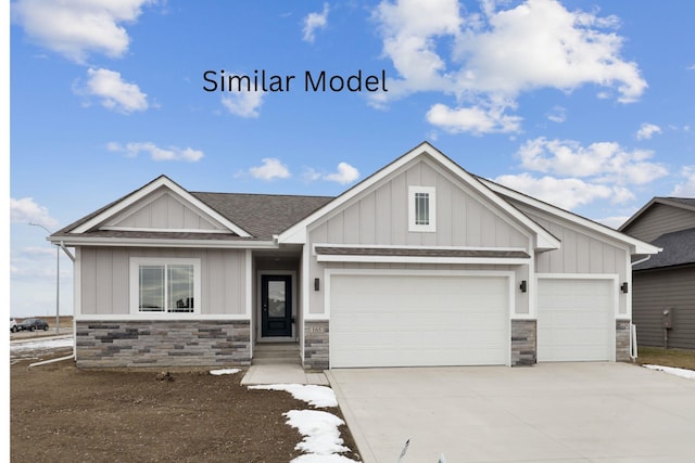 240 NW Lavelle Dr, Waukee, IA 50263 - craftsman-style house featuring board and batten siding, stone siding, a garage, and concrete driveway
