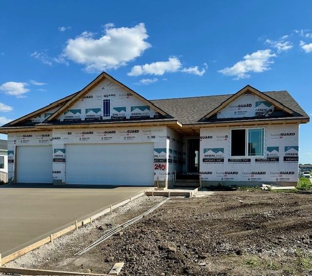 240 NW Lavelle Dr, Waukee, IA 50263 - unfinished property with a garage and driveway