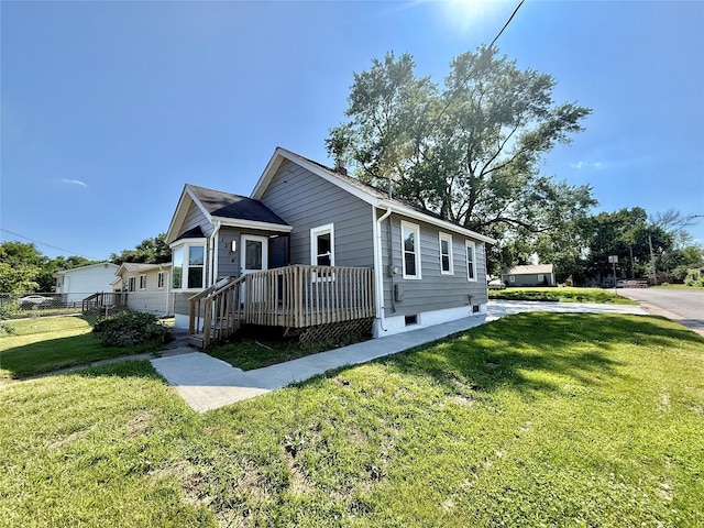 1254 E 16th St, Des Moines, IA 50316 - view of front of house featuring a front yard and a deck