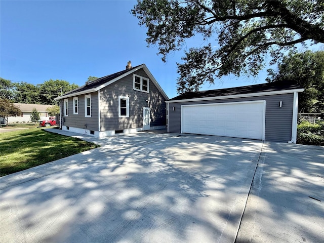 1254 E 16th St, Des Moines, IA 50316 - view of front of home with a chimney and an outdoor structure