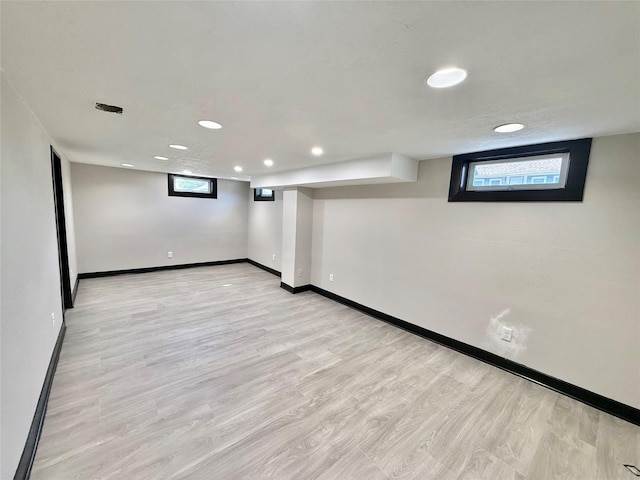 1254 E 16th St, Des Moines, IA 50316 - below grade area with recessed lighting and light wood-style floors