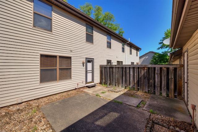 8628 Alpine Dr Unit C, Urbandale, IA 50322 - rear view of property featuring a patio