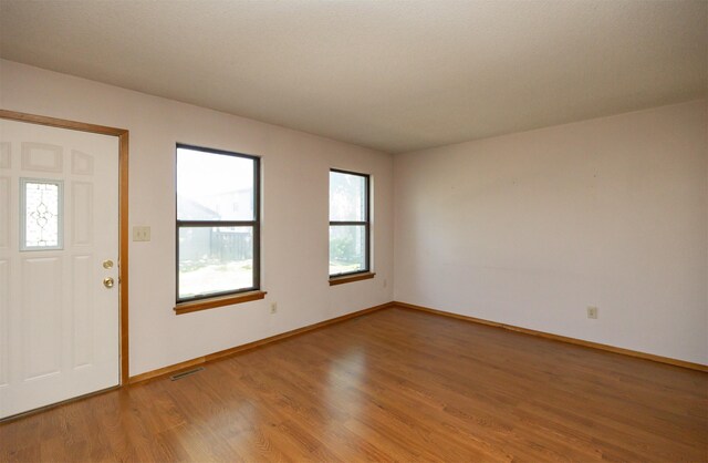 8628 Alpine Dr Unit C, Urbandale, IA 50322 - entrance foyer featuring light wood-style floors and baseboards