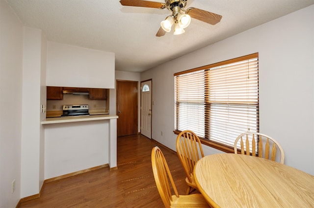 8628 Alpine Dr Unit C, Urbandale, IA 50322 - dining room with dark wood finished floors and a ceiling fan