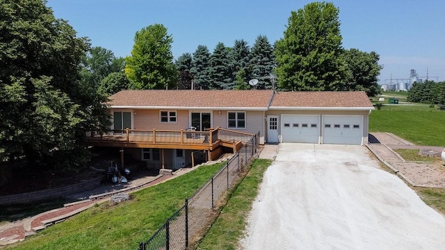 28453 530th Ave, Kelley, IA 50134 - single story home featuring concrete driveway, an attached garage, and a deck