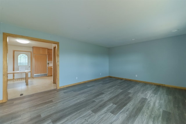 28453 530th Ave, Kelley, IA 50134 - spare room with baseboards and wood finished floors