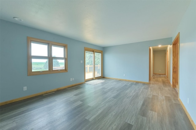 28453 530th Ave, Kelley, IA 50134 - spare room featuring light wood-style floors and baseboards