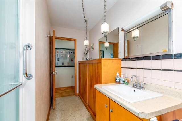 501 N Orchard St N, Brooklyn, IA 52211 - bathroom featuring vanity and backsplash