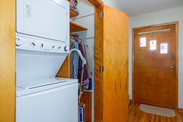501 N Orchard St N, Brooklyn, IA 52211 - washroom with estacked washer and dryer and wood finished floors