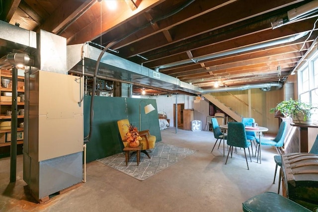 501 N Orchard St N, Brooklyn, IA 52211 - below grade area featuring stairs and heating unit