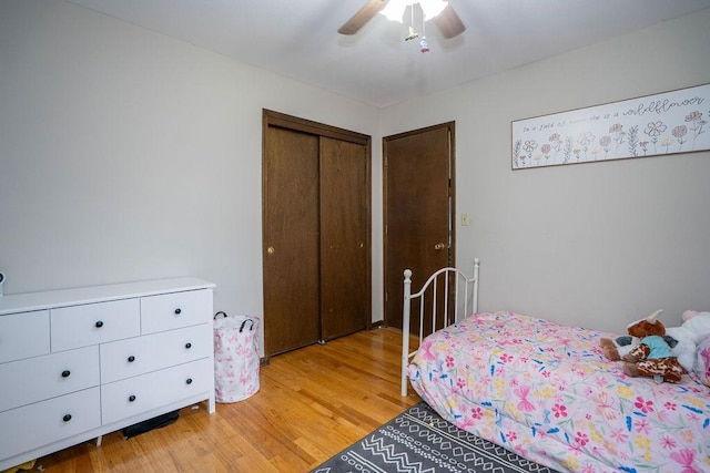 331 E 24th St N, Newton, IA 50208 - bedroom with light wood-style flooring, a closet, and ceiling fan