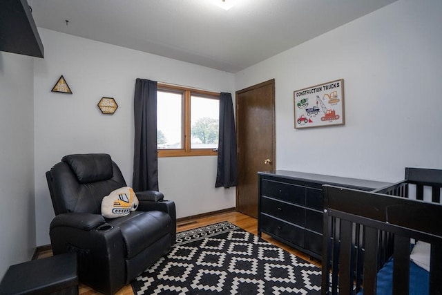 331 E 24th St N, Newton, IA 50208 - bedroom with light wood-style flooring