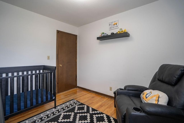 331 E 24th St N, Newton, IA 50208 - bedroom featuring light wood-style floors and baseboards