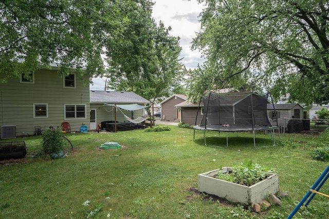 331 E 24th St N, Newton, IA 50208 - view of yard with a trampoline and a vegetable garden