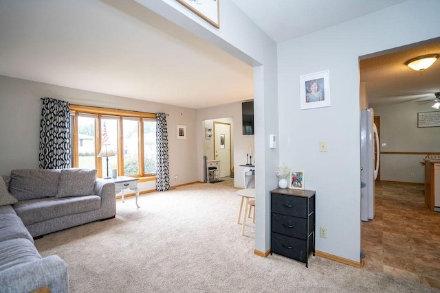 331 E 24th St N, Newton, IA 50208 - living area featuring light colored carpet and a ceiling fan