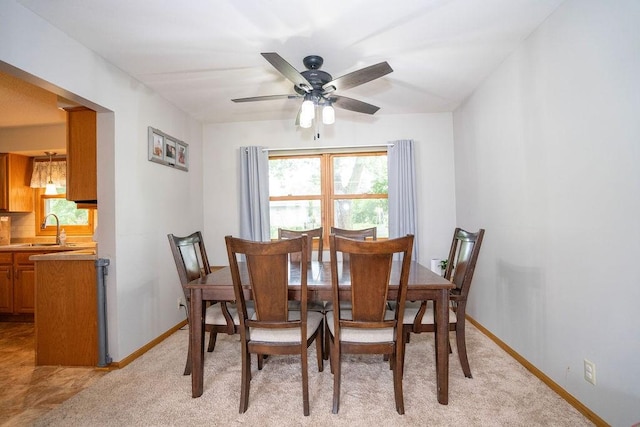331 E 24th St N, Newton, IA 50208 - dining area with baseboards and ceiling fan