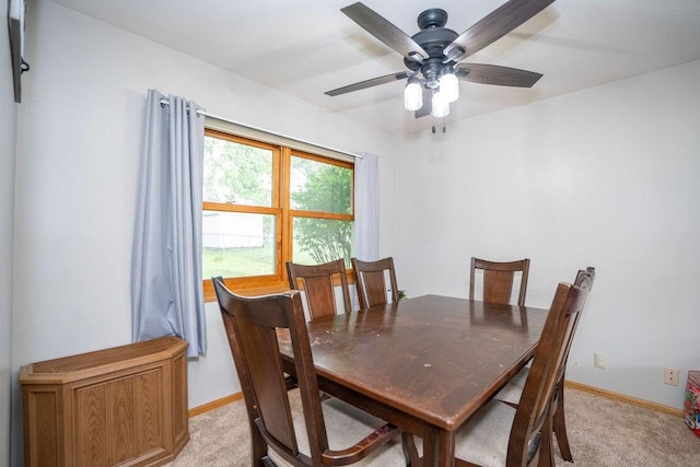 331 E 24th St N, Newton, IA 50208 - dining space featuring a ceiling fan and light colored carpet