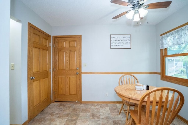 331 E 24th St N, Newton, IA 50208 - dining area with a ceiling fan and stone finish floors