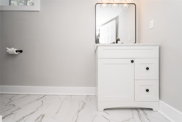 2715 Center St, Des Moines, IA 50312 - bathroom featuring marble look tiles and vanity