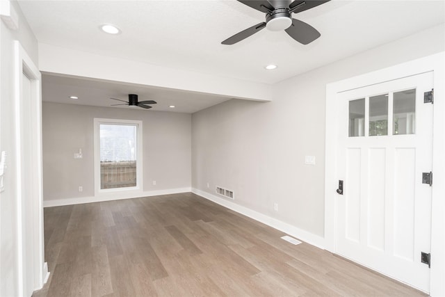 2715 Center St, Des Moines, IA 50312 - empty room featuring a ceiling fan, wood finished floors, and recessed lighting