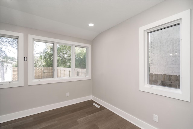 2715 Center St, Des Moines, IA 50312 - empty room featuring dark wood finished floors, recessed lighting, and vaulted ceiling