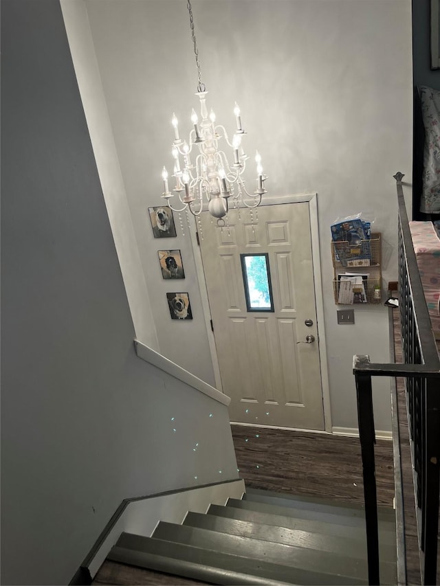 815 Knob Hill Dr, Des Moines, IA 50317 - entrance foyer with a chandelier, wood finished floors, and stairs