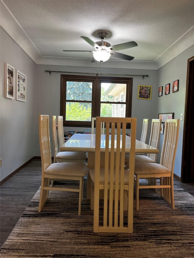 815 Knob Hill Dr, Des Moines, IA 50317 - dining area with a textured ceiling, ceiling fan, and wood finished floors