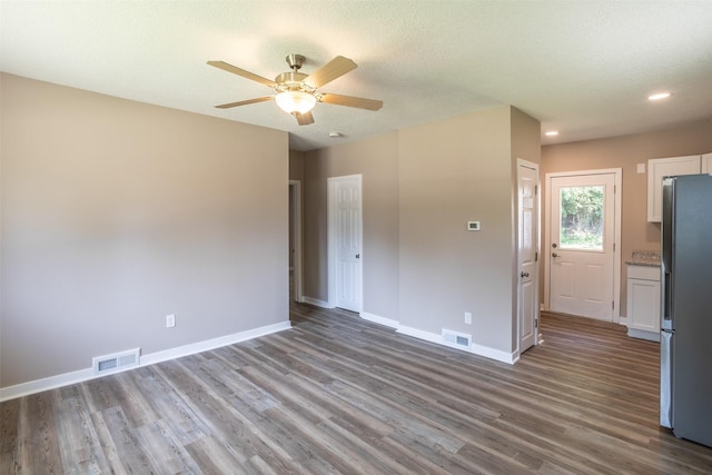 2311 Williams St, Des Moines, IA 50317 - unfurnished room featuring wood finished floors, a ceiling fan, recessed lighting, and a textured ceiling