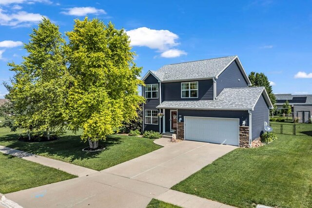 1329 Joshua Cir SE, Bondurant, IA 50035 - view of front of home with concrete driveway, roof with shingles, and an attached garage