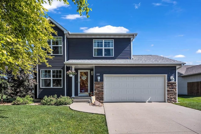 1329 Joshua Cir SE, Bondurant, IA 50035 - traditional-style home featuring a front yard, concrete driveway, stone siding, and a shingled roof