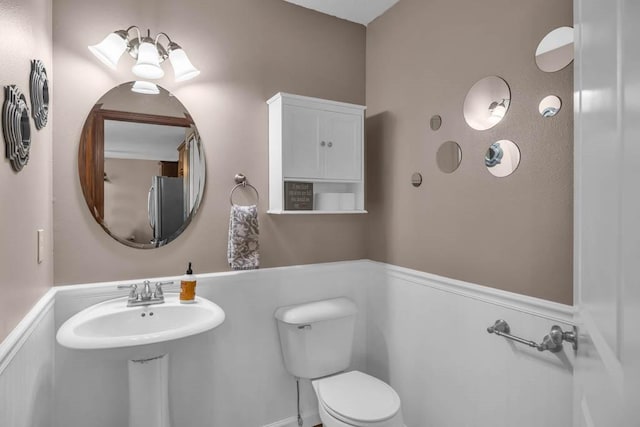 1329 Joshua Cir SE, Bondurant, IA 50035 - bathroom featuring a wainscoted wall