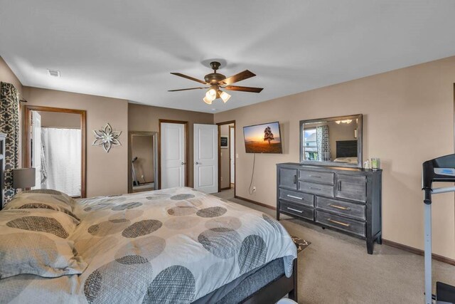 1329 Joshua Cir SE, Bondurant, IA 50035 - bedroom with carpet and ceiling fan
