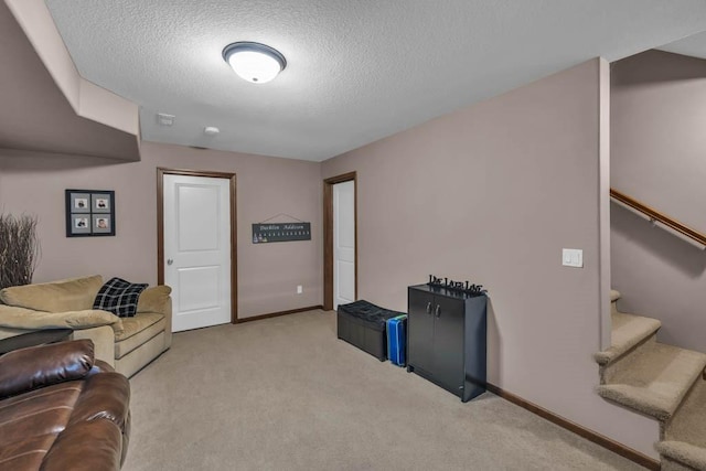 1329 Joshua Cir SE, Bondurant, IA 50035 - living room with carpet flooring, a textured ceiling, and stairs