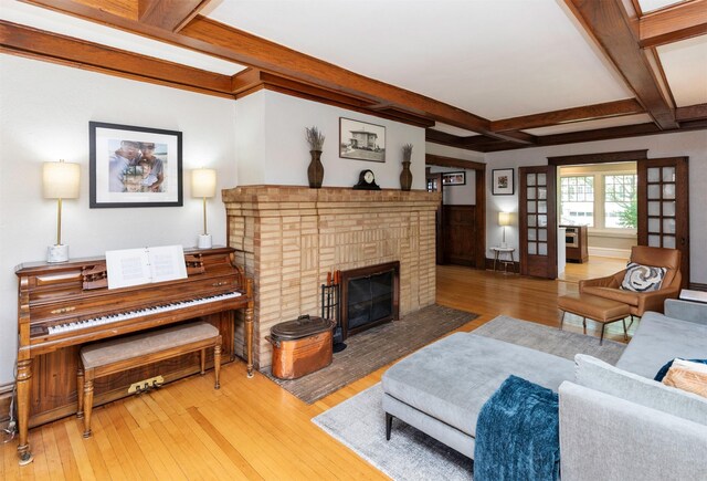 642 Polk Blvd, Des Moines, IA 50312 - living room with coffered ceiling, hardwood / wood-style floors, beam ceiling, and a fireplace