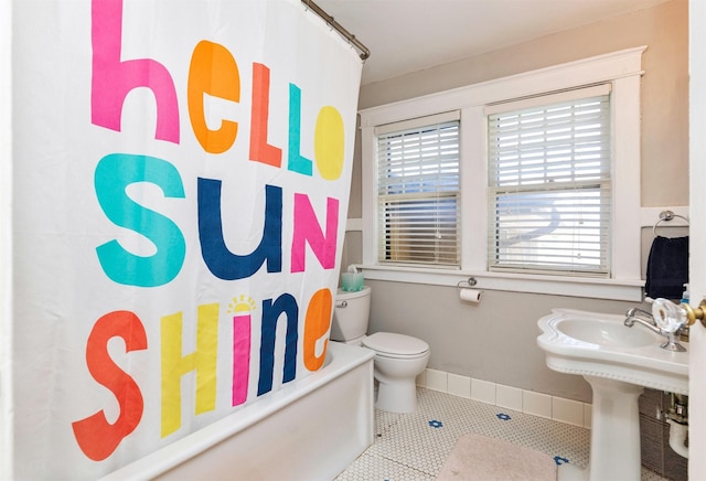 642 Polk Blvd, Des Moines, IA 50312 - full bathroom with shower / tub combo with curtain and tile patterned flooring