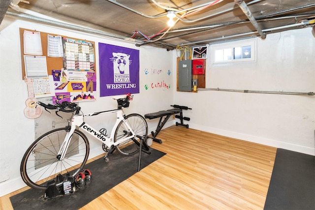 642 Polk Blvd, Des Moines, IA 50312 - exercise room featuring electric panel and wood finished floors