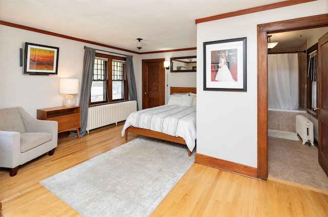 642 Polk Blvd, Des Moines, IA 50312 - bedroom with radiator, light wood-style floors, and crown molding