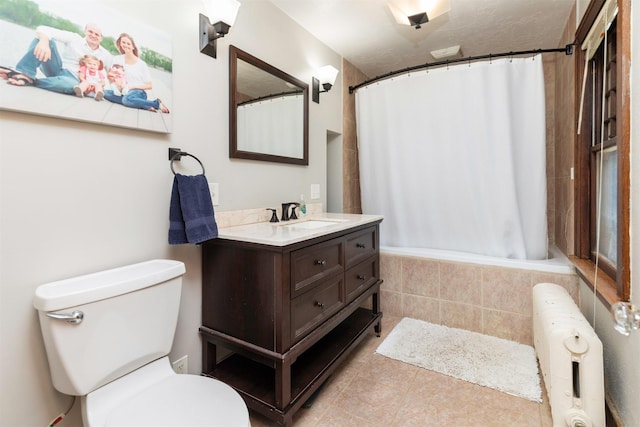 642 Polk Blvd, Des Moines, IA 50312 - full bath with tile patterned floors, vanity, tiled shower / bath, and radiator