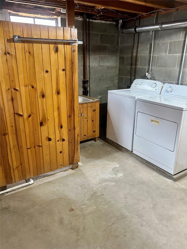 2327 Glenbrook Dr, Des Moines, IA 50316 - basement featuring washing machine and clothes dryer and concrete block wall
