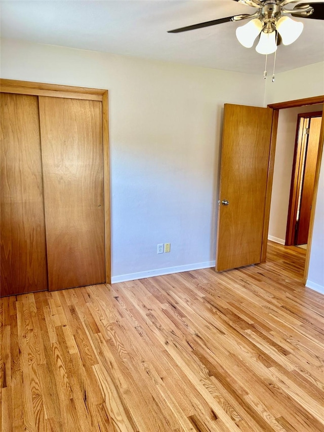 2327 Glenbrook Dr, Des Moines, IA 50316 - unfurnished bedroom with wood finished floors, a closet, and a ceiling fan